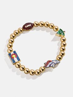 a gold beaded bracelet with charms on it