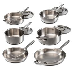 six stainless steel pots and pans on a white background with clipping for text