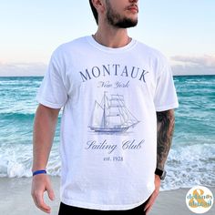 Get ready to be OBSESSED with your new Montauk Sailing Club Tee. It's the cutest and most trendy way to emit all those important Old Money Aesthetics vibes! This is the perfect Social/Sailing Club Shirt! Great as a gift for all the Boating and Sailing lovers out there! Comfort Colors introduces the soft-washed, 100% ring-spun cotton, garment-dyed fabric that brings extra coziness to your wardrobe while the relaxed fit makes it an excellent daily choice. The double-needle stitching throughout the tee makes it highly durable while the lack of side-seams helps the shirt retain its tubular shape.  ❤ The Comfort Colors 1717 tee is made with medium fabric (6.1 oz/yd² (206.8 g/m      consisting of high quality, 100% ring-spun US cotton for long-lasting comfort. ❤ The relaxed fit keeps the wearer Nautical Cotton T-shirt For Sailing, Nautical Crew Neck T-shirt For Boating, Nautical Short Sleeve Beach Top, Summer Sailor Style Short Sleeve Tops, Nautical Cotton Tops For The Beach, White Nautical Style Short Sleeve T-shirt, White Nautical Short Sleeve T-shirt, White Short Sleeve Nautical T-shirt, White Nautical Tops For Vacation