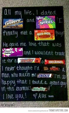 some candy bars are on top of a black board with writing on it and the words i love you written in white