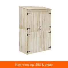 a wooden cabinet with two doors and handles on the front, next to an orange sign that says now trending $ 50 & under