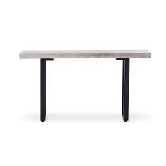 a white table with black metal legs and a long slab on the top, against a white background