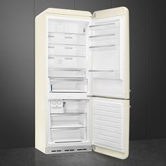 an open refrigerator with its door wide open on a dark surface, showing the interior