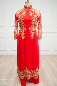 Custom made red Ao Dai with gold lace Collar: 1.8''/4.5cm See through tulle long sleeves Zipper closure Silk satin pants Beadings: yes Materials: silk satin, tulle, lace Elegant Red Ao Dai For Ceremonies, Elegant Red Ao Dai For Ceremony, Elegant Red Ao Dai For Evening, Elegant Red Ao Dai For Banquet, Elegant Fitted Wedding Dress For Traditional Ceremonies, Elegant Cheongsam For Traditional Ceremonies, Elegant Fitted Ao Dai For Traditional Ceremonies, Elegant Long Sleeve Ao Dai For Traditional Ceremonies, Red Long Sleeve Cheongsam For Wedding