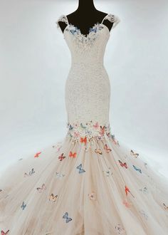 a white dress with butterflies on it