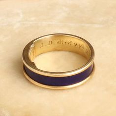 This unassuming gold and blue enamel ring is so much more than meets the eye. Dating to the Regency period, this elegant piece is mourning ring engraved with the following details: "J. D. died 24th May 1825 Aged 84." The interior golds a hinged locket which once would have held plaited hair of the deceased but is now empty. This style of concealed locket mourning ring is quite unusual and very very special. It is a size 6 and cannot be resized. Plaited Hair, Pearl Cluster Ring, Aluminum Bracelets, Monogram Hearts, Regency Period, More Than Meets The Eye