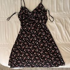 Never Worn, Perfect Condition, Back Top Part Of Dress Ties Together Black Floral Print Summer Sundress, Black Mini Dress With Spaghetti Straps For Spring, Black Mini Sundress For Spring, Fitted Black Sundress For Vacation, Black Floral Print Summer Mini Dress, Black Floral Print Sundress, Black Floral Print Summer Dress, Black Floral Print Midi Sundress, Black Casual Sundress For Spring