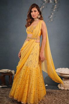 Sunshine yellow pre-draped lehenga saree in georgette, net and chiffon base with zari, beads, sequins and mukaish embroidery. Comes with a padded blouse and a belt.
Components: 3
Pattern: Embroidered
Type Of Work: Zari, Beads, Sequins, Mukaish
Neckline: Square Neck
Sleeve Type: Sleeveless
Fabric: Georgette, Net, Chiffon
Color: Yellow
Other Details: 
Attached lining
Lehenga length : 44 inches
Closure :
Lehenga : Side zip
Blouse - Back tie-up
Occasion: Destination Wedding - Aza Fashions Mukaish Embroidery, Drape Lehenga, Mehendi Outfit, Haldi Outfits, Haldi Outfit, Yellow Lehenga, Blue Lehenga, Yellow Saree, Lehenga Saree