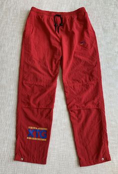 Vintage Puma Women’s Track Pants Sz XL Vented Red Lined Elastic Waist 100% Nylon Very good pre-owned condition. Minor signs of being worn Please see photos for measurements Embroidered Cat Logo. Lined Adjustable leg openings Adjustable waist with drawstring Side hand pockets with Velcro closure Ships with USPS First Class Thanks for looking Stk 2407. University Red Casual Bottoms For Streetwear, Casual University Red Bottoms For Streetwear, Red Nylon Sporty Pants, Sporty Red Nylon Pants, Red Nylon Sports Bottoms, Sporty Red Nylon Bottoms, Casual Red Pants For Outdoor, Casual Red Outdoor Pants, Red Nylon Sports Pants