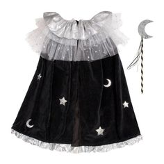 Transform into a witch or wizard with this elegantly creepy costume. It includes a cape and a wand crafted from velvet, tulle and silver lame with silver glitter star and moon details. A fabulous outfit to wear for Halloween, or whenever you fancy casting spells in style! *hat sold separately* The cape is made from black velvet, with chunky silver glitter star and moon details It features a collar crafted from white tulle layers and shiny silver lamé, and embellished with silver glitter stars It Black Witch Dress, Black Witch Costume, Witch Cape, Creepy Costume, Childrens Halloween Costumes, Creepy Costumes, Cape Costume, Velvet Cape, Capes For Kids