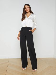 L'AGENCE - $450.00 | Our favorite straight-leg pant, now in versatile black. With a touch of comfortable stretch, the Livvy trouser hugs from contoured waistband to upper thigh, then releases into a full straight leg for a balanced silhouette. Understated slit pockets and hidden closures blend seamlessly into the design. Pair with an elegant silk blouse and heel for the perfect office-to-dinner look. #lagence #AD #blacktrousers Black Trousers Outfit Casual, Black Trousers Outfit Work, Trousers Outfit Work, Trousers Outfit Casual, Black Trousers Outfit, Selena Dress, Liquid Fabric, Leg Pants Outfit, Trouser Outfit