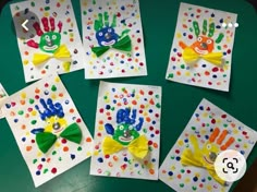 five handprinted cards with different designs on them