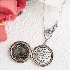 "This magnificent Victorian style embossed locket opens to reveal the quote \"Side by side or miles apart sisters are always close at heart.\" The locket features a beautiful embossed floral pattern on the locket face. The lovely soldered rolo chain features a gorgeous heirloom quality Swarovski crystal rhinestone connector (in your choice of blue opal and light sapphire, white opal & crystal, pacific green opal & chrysolite, or sand opal & topaz) adorned with an exquisite baroque fl Sister Wedding Gifts, Soul Sister Gifts, Necklace Sister, Soul Sisters Gifts, Pacific Green, Sister Wedding Gift, Miles Apart, Satin Noir, Sister Jewelry