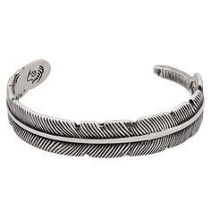 PRICES MAY VARY. NATIVE AMERICAN-INSPIRED DESIGN: This stainless steel cuff bracelet features a detailed feather motif, symbolizing trust, honor, strength, wisdom, power, and freedom in Native American culture. PREMIUM STAINLESS STEEL: Crafted from high-grade stainless steel for lasting durability, the bracelet is accentuated with a beautiful gold-tone band, creating an elegant two-tone effect. ADJUSTABLE AND COMFORTABLE FIT: The open cuff design allows for easy size adjustment to fit most wrist Feather Cuff Bracelet, Native American Feathers, Feather Cuff, Cuff Design, Feather Bracelet, American Culture, Meaningful Jewelry, Native American Culture, Bracelet Jewelry