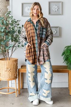 Express Your Unique Style with Our Mixed Plaid Button-Front Top Add a touch of eclectic charm to your wardrobe with our Mixed Plaid Button-Front Top. Designed for trendy moms who love to stand out, this top features a creative blend of plaid patterns in rich, earthy tones. The relaxed, oversized fit and long sleeves make it perfect for layering over your favorite tees or wearing on its own for a casual, laid-back look. The button-front design adds versatility, allowing you to style it open or cl Winter Patchwork Button-up Top, Plaid Button-up Tops For Fall, Fall Plaid Button-up Tops, Casual Plaid Patchwork Tops, Plaid Tops With Button Closure And Relaxed Fit, Trendy Button-up Patchwork Tops, Trendy Patchwork Button-up Top, Plaid Top With Button Closure And Relaxed Fit, Brown Patchwork Top For Fall