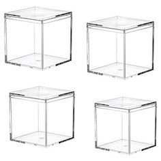 four clear cubes sitting next to each other