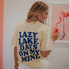 Whether they're headed to the lake for a weekend of fun or just daydreaming about lazy days by the water, this tee is for them! The comfortable, relaxed fit and oversized graphics on the back make it a staple piece for your summer wardrobe. Plus, who doesn't love a little bit of water-inspired fashion? So they'll throw on this shirt and head to the nearest body of water...their perfect summer awaits! 100% ring spun cotton comfort colors t-shirts designed in the USA garment dyed fabric ribbed col Summer Tshirt Designs, Dog Lifestyle, Granola Girl Aesthetic, Lake Days, Wholesale T Shirts, Pink Cowgirl, Tshirt Crafts, Wholesale Shirts, Girls Graphic Tee