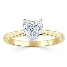 a heart shaped diamond engagement ring in yellow gold