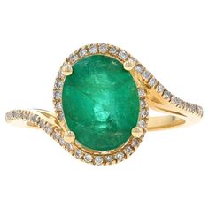 Size: 6 1/2 Sizing Fee: Up 2 sizes for $35 Metal Content: 14k Yellow Gold Stone Information Natural Emerald Treatment: Oiling Carat(s): 2.30ct Cut: Oval Color: Green Natural Diamonds Carat(s): .20ctw Cut: Single Color: G - H Clarity: SI1 - SI2 Total Carats: 2.50ctw Style: Solitaire with Accents Halo Bypass Measurements Face Height (north to south): 1/2" (12.7mm) Rise Above Finger: 5/16" (7.6mm) Weight: 3.6 Grams Stamps: 14k, maker's mark Condition: New without Tags We have been dealing in fine n Antique Emerald Ring, Bypass Ring, Diamond Wedding Ring, La Face, Gold Stone, Maker's Mark, Stone Cuts, Diamond Halo, Emerald Diamond