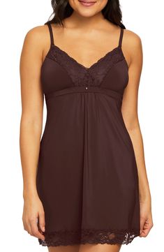 The perfect balance of sweet and sultry, this supportive babydoll chemise is made of a comfortable stretch knit and finished with a romantic lace trim. Slips on over head V-neck Adjustable straps Lined 85% nylon, 15% spandex Hand wash, line dry Imported Women's Clothing Lace V-neck Camisole, Coquette Chemise With Spaghetti Straps And Built-in Bra, Fitted Seamless V-neck Sleepwear, Lace Trim Cami Chemise, Stretch V-neck Camisole For Sleep, Stretch Spaghetti Strap Camisole For Sleep, Stretch Camisole With Spaghetti Straps For Sleep, Coquette Sleepwear With Built-in Bra And V-neck, Coquette V-neck Sleepwear With Built-in Bra