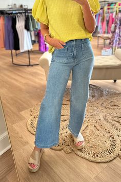 Get ready to strut your stuff in these light wash denim jeans with a wide leg and high waist. These jeans also feature a stylish patch pocket on the front and a finished hemline. Perfect for a trendy look! Stocked at Arlington Village. Retro Spring Cargo Jeans In Denim, Trendy Light Wash Wide Leg Flare Jeans, Retro Wide Leg Cargo Jeans For Spring, Chic Medium Wash Straight Leg Cargo Jeans, Chic Straight Leg Medium Wash Cargo Jeans, Chic Wide Leg Medium Wash Cargo Jeans, Chic Light Wash Wide Leg Flare Jeans, Chic Light Wash Wide Leg Jeans, Chic Light Wash Denim Flare Jeans