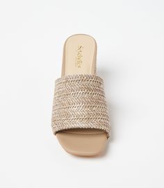 Conquer your day with ease with these raffia slides that strike the perfect balance between a walkable heel height and on-trend style. This design features padded OrthoLite Hybrid insoles and a patented down curve, ensuring a natural and comfortable stride with arch support. The raffia material adds a hint of texture and a bohemian charm, making these sandals a versatile addition to your wardrobe. Raffia upper Heel height: 2 3/4 inches Imported True to size Seychelles | Karen Kane Adapt Raffia H Casual Slide Heels For Beach, Casual Beach Slide Heels, Summer Slip-on Sandals With Padded Heel, Summer Slip-on Mules With Wedge Heel, Trendy Beach Mules With Padded Heel, Summer Flat Mules With Padded Heel, Casual Heels With Padded Heel For Vacation, Casual Slide Heels For Summer, Casual Summer Slide Heels