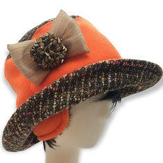 tweed hat.Warm orange hat for women with nature Golden Tiger Eye Tumbled Stone. Wool and fleece hat. With wide brim. Hat bucket with bow and stones. 22-23in. (55-58sm) (S-M) New! Fashionable hats for the winter of 2022. Designers recommend. The hat will always protect you from the cold. You are adorable in this hat and decorate the street. You just need to reach, shake and put on, slightly pushing the edges with your hands. The hat is made by hand by designers from Estonia. The hat has a lining and wadding, the fabric itself is wool, fleece, and a decoration with a gold tiger's eye, a lot of stones. Orange brimmed hat. a rough, unfinished woolen fabric, of a soft, open, flexible texture resembling cheviot* or homespun, but more closely woven. It is made in either plain or twill weave and m Adjustable Wool Bucket Hat, Orange Hat With Short Brim, One Size Fits Most, Orange Short Brim Hat, One Size, Orange Short Brim Hat, One Size Fits Most, Orange Wide Brim Hat For Fall, Adjustable Orange Hat For Fall, Adjustable Cloche Hat For Fall Outdoors, Adjustable Cloche Hat For Fall Outdoor Events, Fall Adjustable Cloche Hat For Outdoor