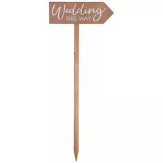 a wooden sign that says wedding this way