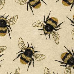 bees on white fabric with gold and black accents