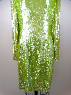 "This is a stunning sequined party dress from Black Tie Oleg Cassini! It's fully embellished with bright lime green pailette sequins and in excellent condition! Bust - 40\" Waist - 32\" Hips - 42\" Length - 36\" Tag Size - 14 (please refer to measurements) This dress comes from a pet-free and smoke-free home. If you would like more info or have any questions, please don't hesitate to ask!" Fitted Green Sequin Dress For Wedding, Green Sequin Cocktail Dress For Holidays, Holiday Green Sequin Cocktail Dress, Green Sequined Holiday Dress, Sparkling Spring Dress For Festive Occasions, Holiday Green Sequined Dresses, Spring Festive Sparkling Dress, Sparkling Spring Festive Dress, Green Glamorous Sequin Fabric For Party Season