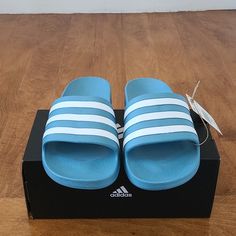 Denim Blue Colored Adidas Sandals. Size 7 Women, Would Fit Someone Who Wears A Size 8 Regularly In Women Shoes. Color Is A Bit Brighter In The Pictures. It Is Really More Of A Blue Jean Color. Sporty Blue Slides For Vacation, Blue Slip-on Summer Flip Flops, Blue Sporty Flip Flops For Vacation, Sporty Blue Flip Flops For Vacation, Blue Sporty Sandals For Beach, Blue Flat Slippers For Summer, Summer Adidas Slides, Comfortable Blue Slides For Summer, Casual Light Blue Non-slip Sandals