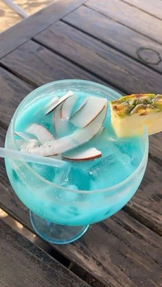 a blue drink sitting on top of a wooden table