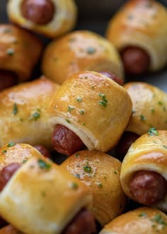 hotdogs wrapped in bread and topped with cheese