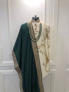 Drop Any sort of personalization requests for the embroidery,color, shawl,turban,neckpeice(mala) The set includes all the items represented in the photo 1) Sherwani 2)Churidars bottoms 3)Neckpeice 4)Shawl If the client is looking for matching shoes we can do that as well(Shoes/Juttis Will Be charged additionally, i.e They are not included in this price) Wedding Sherwani With Dabka Work, Straight Kurta, Eid Sherwani With Resham Embroidery For Traditional Ceremonies, Traditional Sherwani With Intricate Embroidery For Eid, Intricate Embroidered Sherwani For Eid, Semi-stitched Sherwani With Intricate Embroidery, Eid Sherwani With Intricate Embroidery And Traditional Drape, Eid Sherwani With Intricate Embroidery, Festive Sherwani With Intricate Embroidery For Traditional Ceremonies, Straight Kurta Sherwani For Traditional Ceremonies With Dabka Work