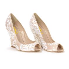 Step into elegance with these nude lace wedding wedge pumps. Featuring an elegant peep toe design, these bridal shoes are the perfect blend of style and comfort. Handcrafted US sizing. Fits true to size. Heel Height: 4.72" / 120 mm approx Product measurements were taken using size 8. Please note that measurements may vary by size. Elegant Beige Open Toe Wedge Sandals, Elegant Open Toe Wedge Sandals For Wedding, Spring Wedding Shoes In Cream Lace, Cream Lace Wedding Shoes For Spring, Elegant Fitted High Heel Wedge Sandals, Spring Cream Lace Wedding Shoes, Elegant Wedge Sandals With Round Toe, Feminine Cream Open Toe Wedding Shoes, Cream Open Toe Heels For Ceremonies