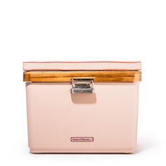 a pink cooler with wooden handles and handlebars on the top, sitting in front of a white background