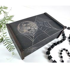 a wooden box with a spider web on it