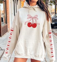 This Cherry Hoodie embodies the vintage Aesthetic with its charming retro design. The hoodie features a delightful bow, adding a touch of Y2K trendiness to its graphic crewneck style. Perfect for those embracing Balletcore or Cottagecore vibes, this shirt makes a thoughtful gift for fashion-forward individuals. For Cherry Sweatshirt: https://bronikowskiart.etsy.com/listing/1674341498 Unisex Gildan 18500 Hoodie Q U I C K / F A C T S * 50% Cotton 50% Polyester * Wash and dry normally (on cool for Oversized Y2k Hooded Top, Oversized Y2k Hoodie For Fall, Oversized Y2k Style Hoodie For Fall, Y2k Style Cotton Hoodie With Long Sleeves, Y2k Cotton Long Sleeve Hoodie, Y2k Style Long Sleeve Cotton Hoodie, Y2k Style Sweatshirt With Drawstring Hood And Long Sleeves, Y2k Long Sleeve Sweatshirt With Drawstring Hood, Oversized Y2k Hoodie With Drawstring Hood