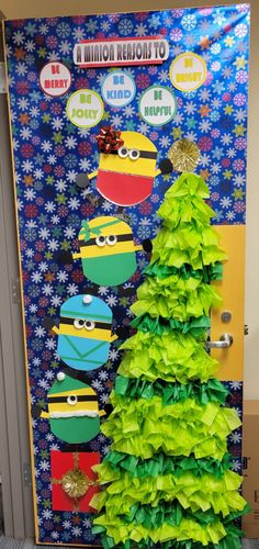 a classroom door decorated for christmas with green paper decorations and minions characters on the front