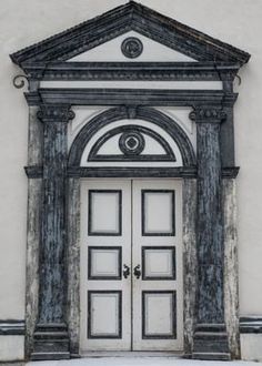 an old building with a door and window