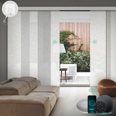 a living room filled with furniture and white walls