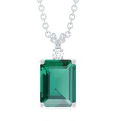 Product Details Prepare to be captivated by the mesmerizing solitaire pendant, showcasing a vibrant octagon-cut lab-created emerald as its centerpiece. The vivid green hue of the created emerald is further accentuated by the illuminating presence of a round moissanite at its base. Held securely with minimal prongs, the pendant is connected to an elegant and sturdy chain. Product Information SKU SHP-PENDANT112035339 Length 12.5 mm Width 6 mm Weight 4.10 gm (Approximate) LAB CREATED EMERALD INFORM May Birthstone Radiant Cut Solitaire Jewelry, Anniversary Solitaire Necklace With Emerald Cut In Prong Setting, Emerald Cut Solitaire Necklace With Prong Setting For Anniversary, Anniversary Emerald Cut Solitaire Necklace With Prong Setting, Emerald Cut Solitaire Necklace For Anniversary With Prong Setting, Classic Cubic Zirconia Emerald Necklace, Fine Jewelry Emerald Cut Solitaire Necklace With Prong Setting, Classic Emerald Pendant Necklace With Prong Setting, Emerald Cut Solitaire Necklace With Prong Setting