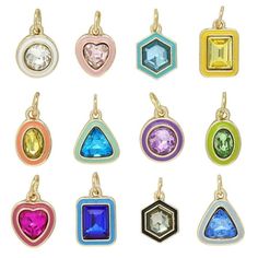 a set of nine pendants with different colored stones on each one, all in various shapes and sizes