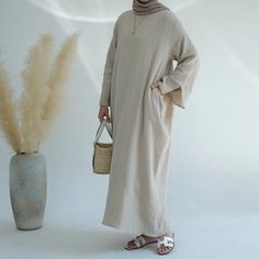 Muslim Women Double Layers Abaya Dress With Pocket – Urgarment Casual Solid Color Abaya For Spring, Casual Abaya For Spring, Casual Solid Abaya For Spring, Casual Long Thobe For Eid, Casual Spring Abaya, Spring Casual Maxi Length Abaya, Spring Beige Long Sleeve Abaya, Beach Modest Long Sleeve Maxi Dress, Casual Solid Color Maxi Length Abaya