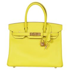 Discover the pinnacle of luxury with our Hermès Birkin 30, a stunning representation of exquisite craftsmanship and timeless style. This iconic handbag, crafted from the renowned Epsom leather, is known for its grainy texture that not only enhances its aesthetic appeal but also ensures durability and scratch resistance. The vibrant lime shade infuses a lively yet elegant charm, making it a standout accessory for any occasion. The Hermès Birkin is not just a bag; it's an investment in unparalleled craftsmanship and enduring style. Ideal for the discerning fashion enthusiast who appreciates luxury that stands out. Stamp: Z - 2021 Gold Hardware Lime / Yellow Colour Height: 23cm Width: 30cm Depth: 15.5cm Come with: Box, Dust Bag, Felt, Lock and Key Grainy Texture, Prince Rainier, Lime Yellow, Birkin 30, Hermes Birkin 30, Jane Birkin, Charm Making, Lock And Key, Grace Kelly