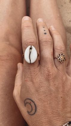 ᛫ 。《 ♢ 》 。᛫ SUMADRA Ring * A Sanskrit term meaning the "gathering together of waters" (saṃ- "together" and -udra "water"). It refers to an ocean, sea or confluence Brass cowrie shell ring. Handmade in India with raw brass and a cowrie shell. Perfect for that boho look! This ring roughly fits a size 10  but also has an adjustment cut at the back and can be fitted for a smaller size (see photo). If you have any questions about this I'd be happy to help! Cowrie shell may differ slightly to the phot Cowrie Shell Jewelry, Indian Rings, Shell Ring, Some Times, Sanskrit, Macrame Cord, Cowrie Shell, Boho Look, Shell Jewelry