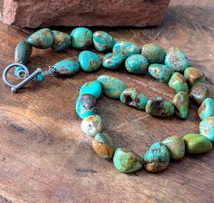 Turquoise Nugget Necklace Kingman Natural Bead Necklace Vintage Turquoise Jewelry Natural Turquoise, Green Brown Turquoise  Natural unstabilized Kingman Turquoise beads. Handcrafted in the Southwest. From 1960s or 70s Turquoise nugget stones are green and brown. The clasp is a toggle clasp. The necklace appears bluer in the photos than it actually is.  Rich and earthy, a great addition to your Southwest Jewelry  Collection.  Can be worn with anything. Measures a bit over 18  inches end to end. Rustic Turquoise Hand-strung Necklace, Artisan Single Strand Turquoise Necklace For Jewelry Making, Artisan Turquoise Necklace For Jewelry Making, Turquoise Chrysocolla Gemstone Beads Necklace, Southwestern Single Strand Turquoise Necklace, Turquoise Chrysocolla Round Beads Necklace, Turquoise Chrysocolla Necklace With Round Beads, Single Strand Turquoise Chrysocolla Necklace, Hand-strung Turquoise Necklace As Gift