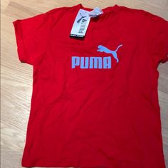 Cotton Puma T Shirt Never Worn Puma Logo Graphic Tee With Crew Neck, Puma Graphic Tee With Crew Neck, Casual Cotton T-shirt With Puma Logo, Puma Logo Cotton Short Sleeve Top, Red Sports T-shirt For Spring, Short Sleeve Cotton Top With Puma Logo, Cotton Short Sleeve Tops With Puma Logo, Puma Graphic Tee With Short Sleeves, Casual Puma Logo Short Sleeve Top