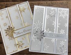 two cards with snowflakes on them, one is white and the other is gold