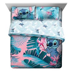 an image of a bed set with lil the pooh and tropical leaves on it